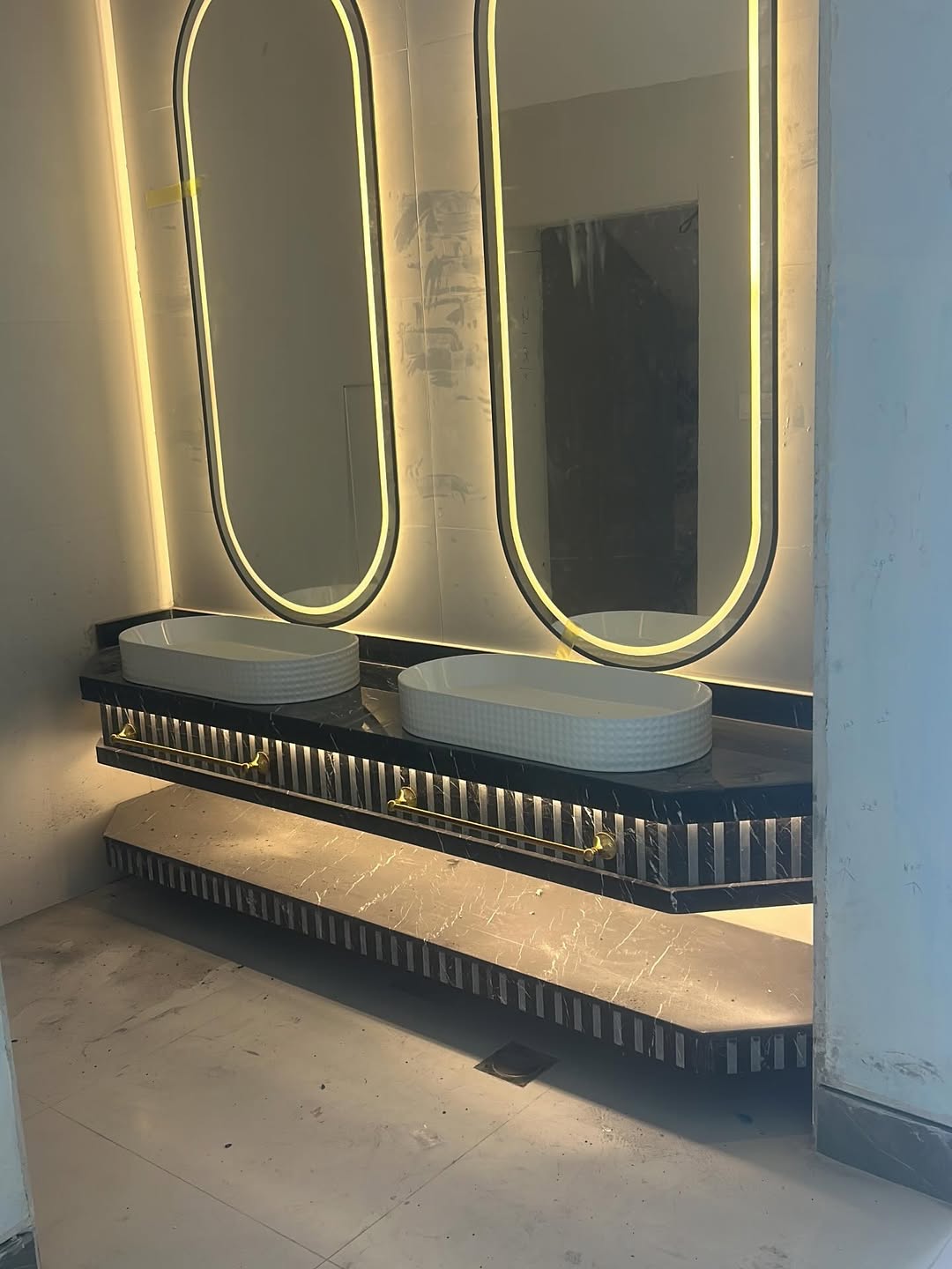 black marble vanity gold rails.jpg